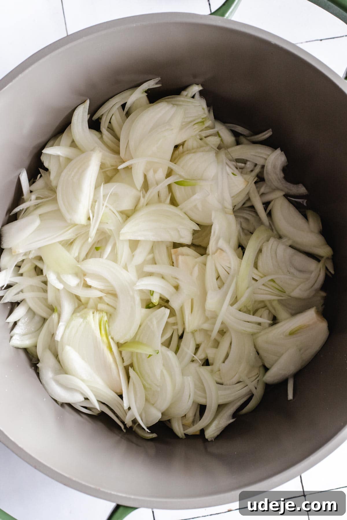 Yemeni Chicken Mandi with Fragrant Spiced Rice 8 Finely sliced onions ready in a large stock pot, prepared for frying.