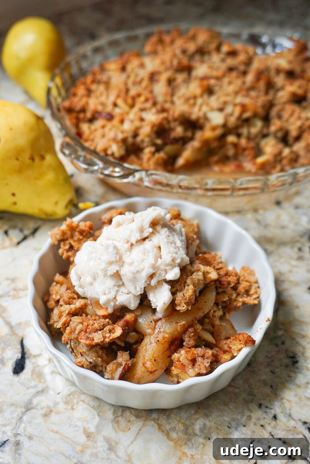 Wholesome Pear Crumble 2 Sweet spiced pears are topped with a wholesome nutty crisp that's bursting with flavor. This Healthy Pear Crisp is vegan, gluten free & refined sugar free.