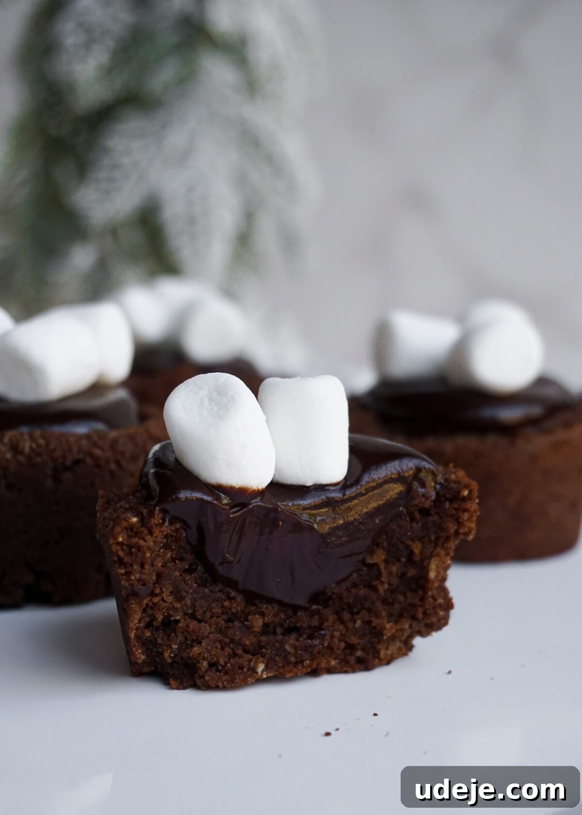 Decadent Vegan and Gluten-Free Hot Chocolate Cookie Cups 3 Close-up of a hot chocolate cookie cup revealing its creamy chocolate ganache filling