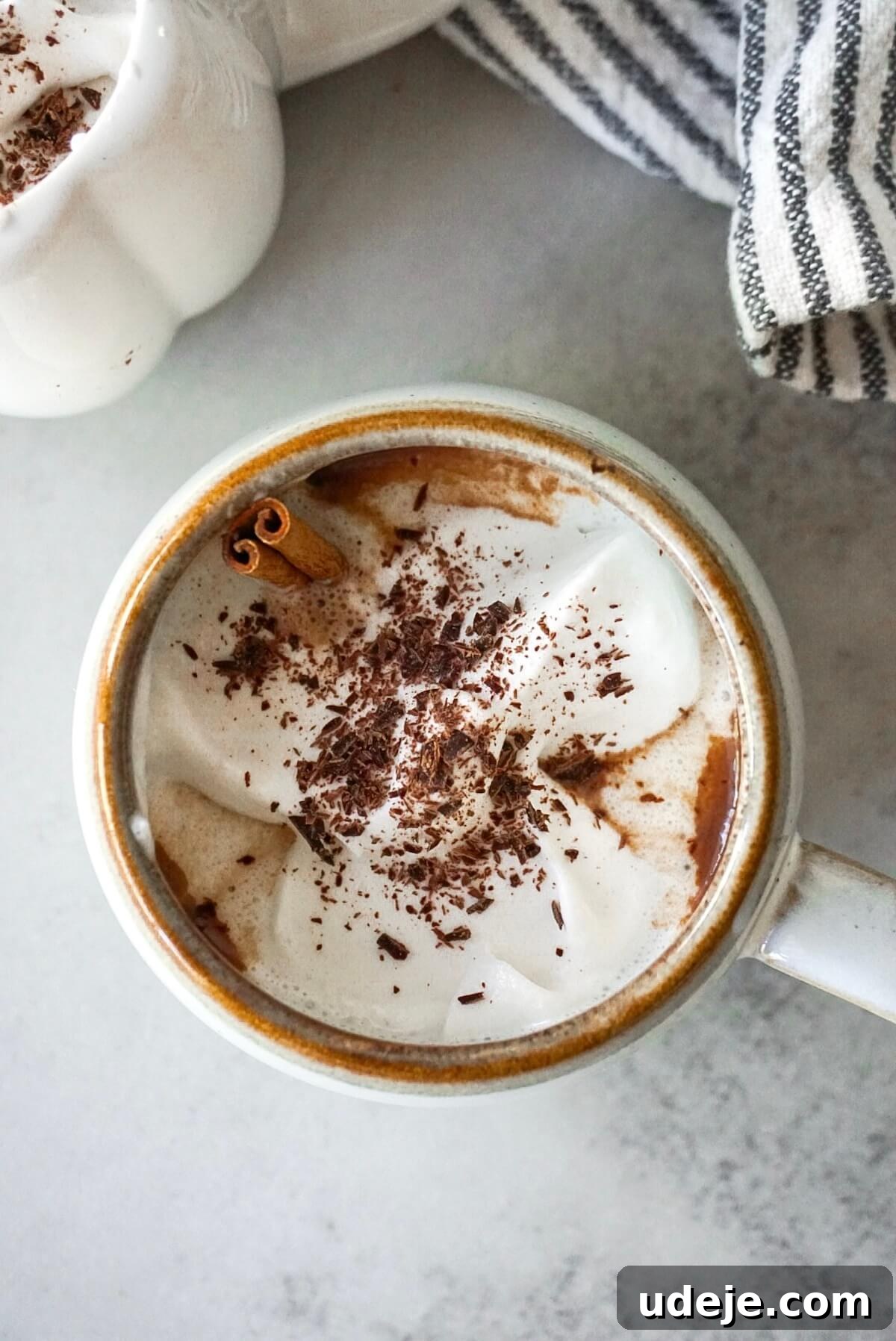 Nourishing Hot Chocolate 4 Three mugs of healthy hot chocolate with different toppings, creating a festive display.