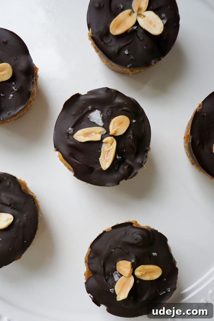 Easy Plant-Based Chocolate Peanut Caramel Cups 3 Snickers in cup form! No baking is required to make these healthier Snickers Cups that are vegan, gluten free, refined sugar free and so delicious.