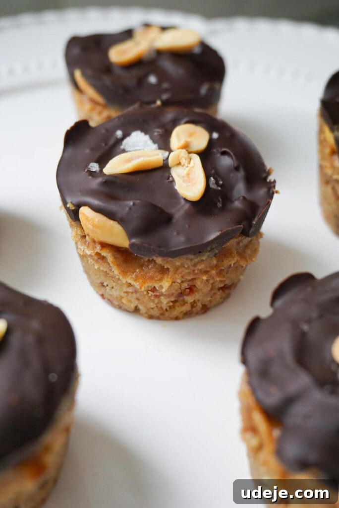 Easy Plant-Based Chocolate Peanut Caramel Cups 4 Snickers in cup form! No baking is required to make these healthier Snickers Cups that are vegan, gluten free, refined sugar free and so delicious.