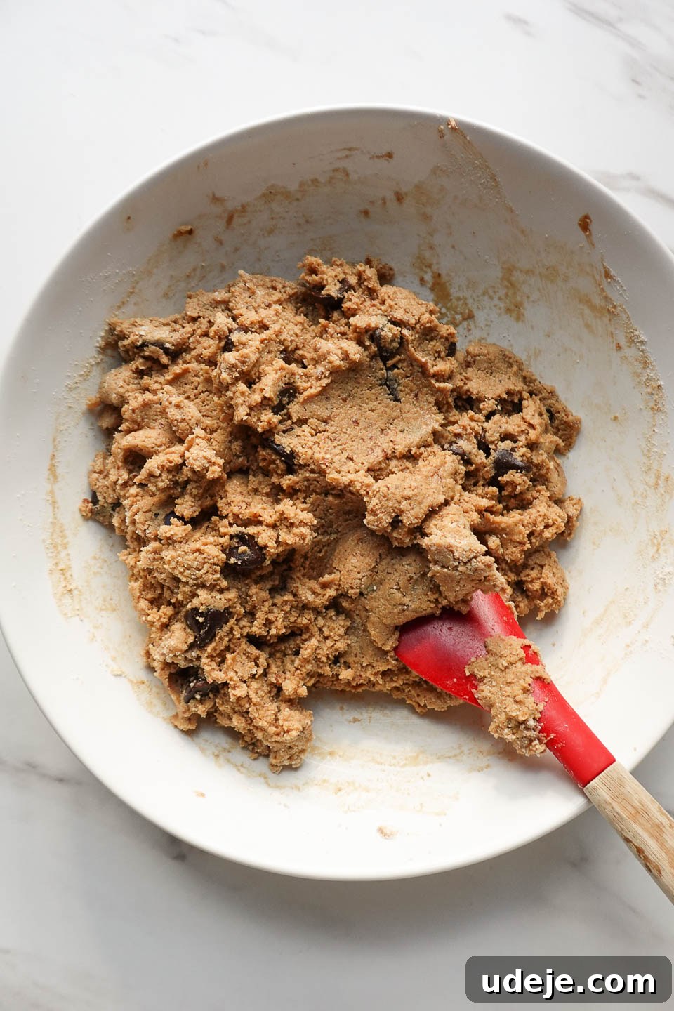 Melt-in-Your-Mouth Vegan Gluten-Free Chocolate Chip Cookies 9 Mixing dough for vegan chocolate chip cookies