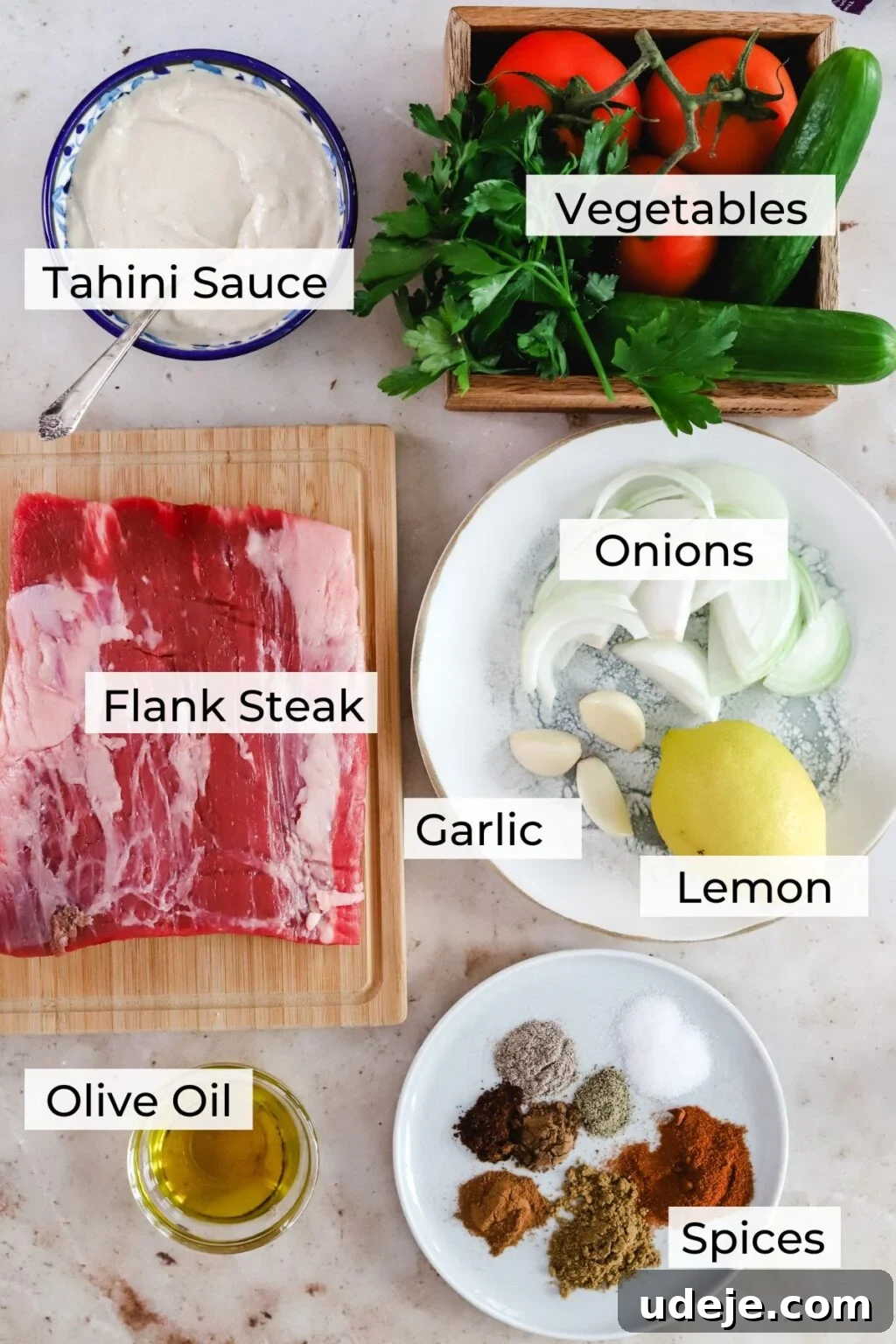 Effortless Skillet Tender Beef Shawarma 4 ingredients for beef shawarma ingredients which are flank steak, vegetables, tahini sauce, onions, garlic, lemon, olive oil, spices