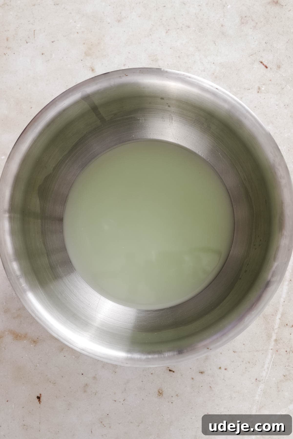 steel bowl with liquid from yogurt