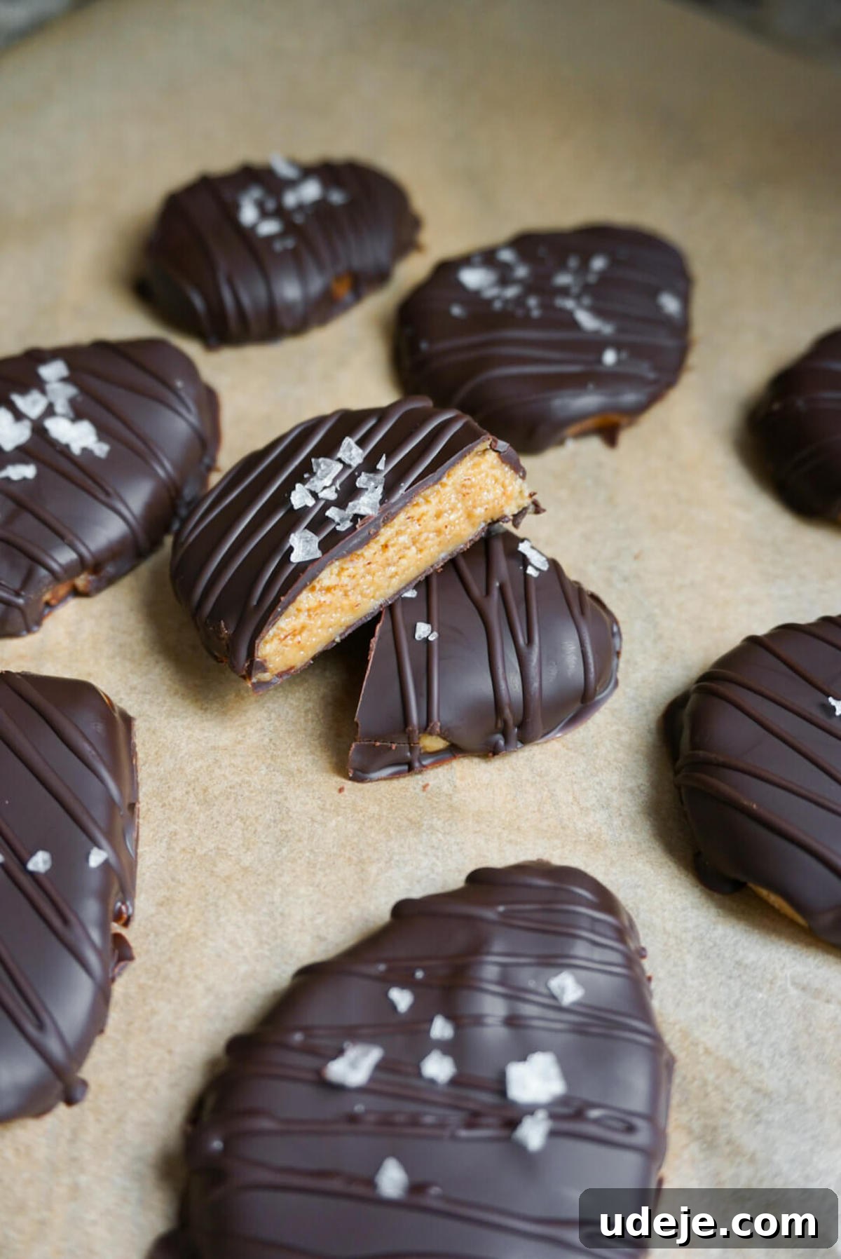 Close-up of healthy 4-ingredient peanut butter eggs, made vegan, gluten-free, and refined sugar-free, coated in chocolate.