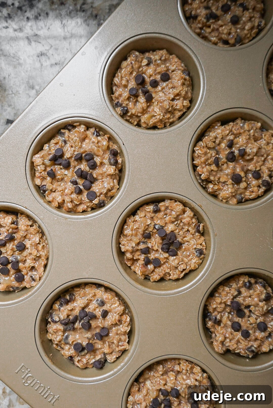 Delicious Peanut Butter Oatmeal Muffins Vegan and Gluten Free 3 Close-up of baked Peanut Butter Oatmeal Muffins, showcasing their fluffy texture and chocolate chips.