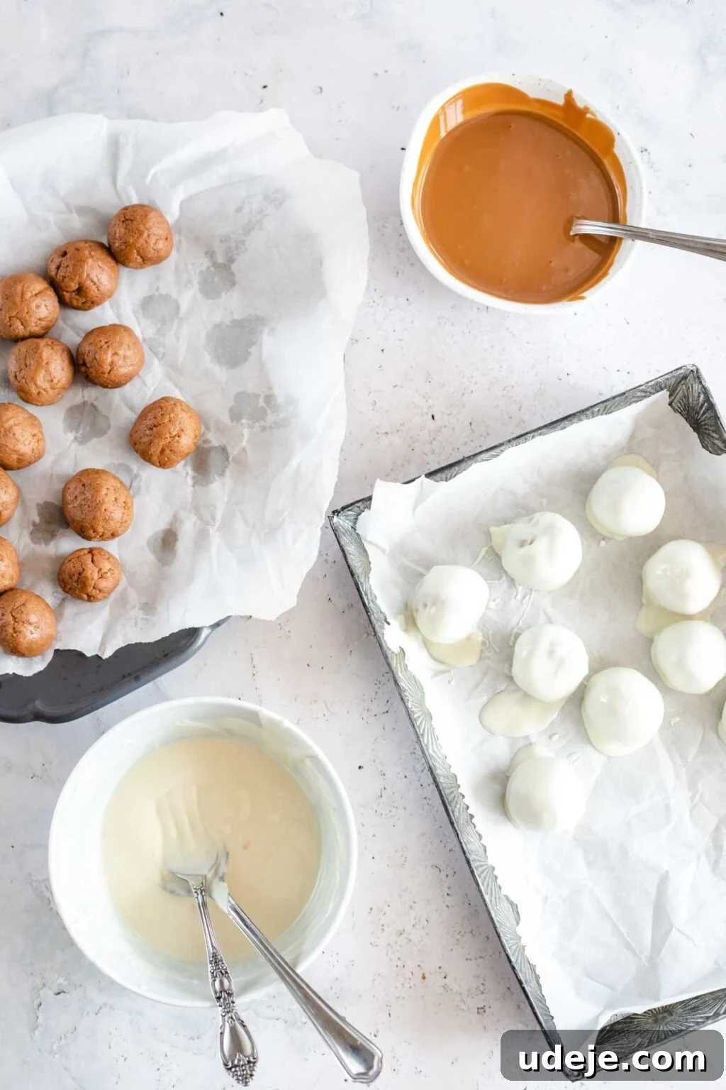 4-Ingredient No-Bake Biscoff Truffles 13 A visual progression showing Biscoff truffle balls on a tray, alongside bowls of melted Biscoff spread and white chocolate, culminating in chocolate-covered truffles on parchment paper, all on a light marbled background.