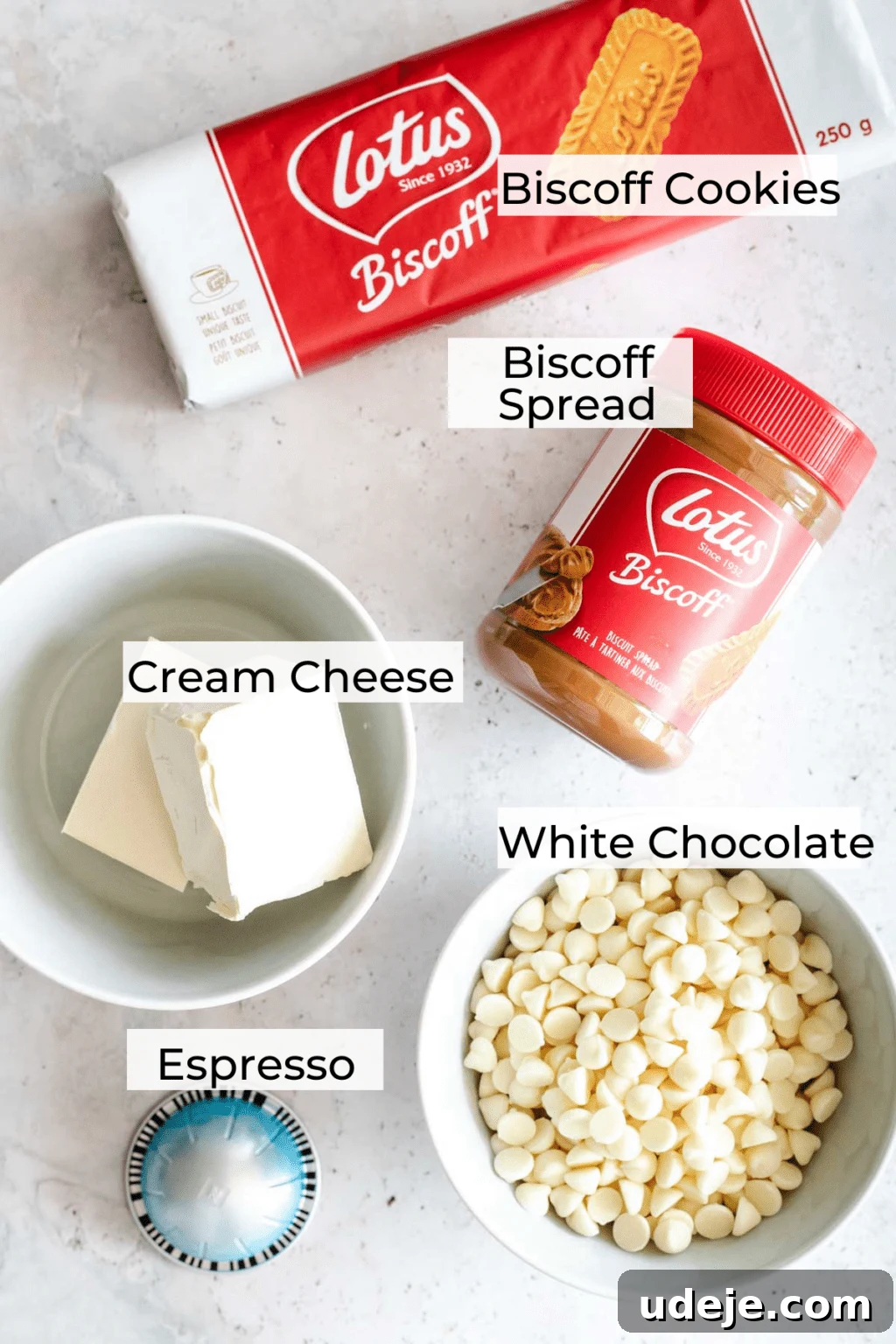 4-Ingredient No-Bake Biscoff Truffles 3 A vibrant ingredient shot for Biscoff truffles, featuring a pack of Lotus Biscoff cookies, creamy Biscoff spread, a bowl of rich cream cheese, white chocolate chips in another bowl, and a single espresso pod, all beautifully arranged.