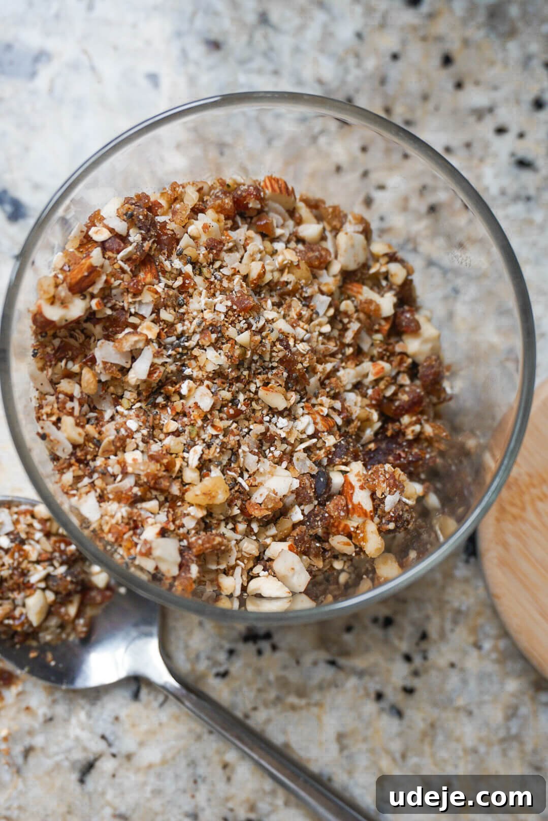 Effortless Raw Granola 2 Rawnola is a no bake granola that's ready in 5 minutes, loaded with dates, pecans, oats, coconut flakes, chia seeds & other nutritious ingredients. It's naturally sweetened & insanely delicious!