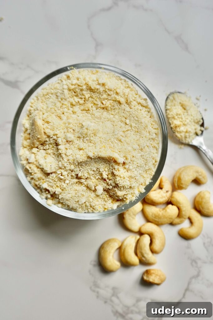 Golden Cashew Parmesan Sprinkle 2 This 4 ingredient vegan cashew parmesan is my go-to for sprinkling on pasta, salads, grain bowls, and more. It takes 5 minutes to make and tastes delicious!