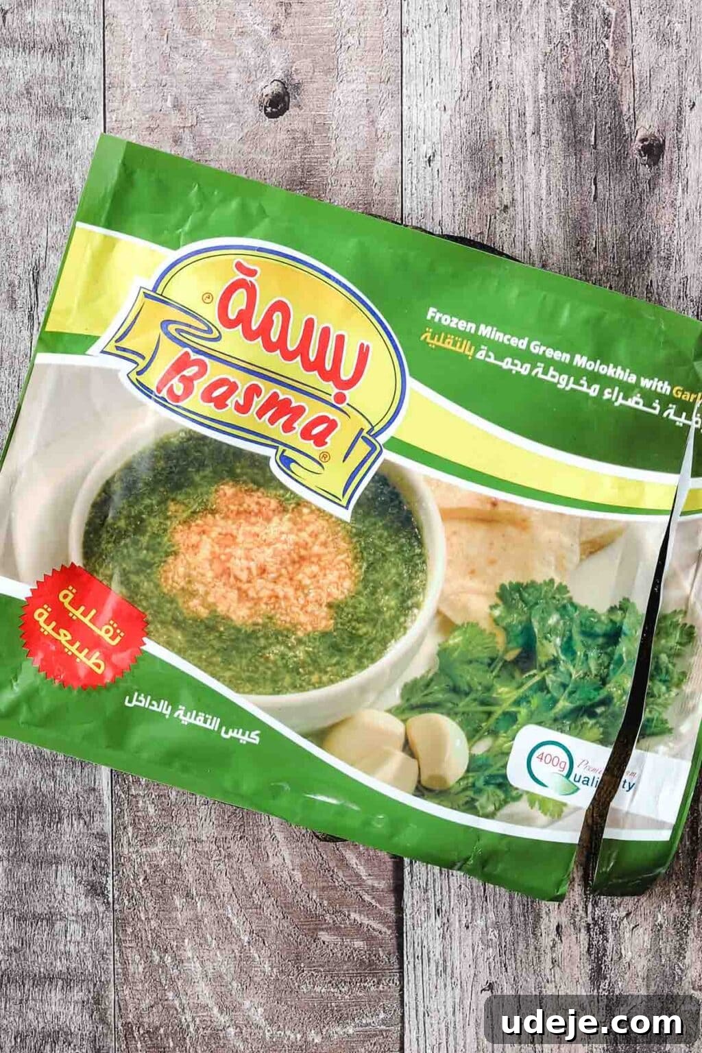 Molokhia: A Timeless Tradition 4 Packaged frozen molokhia on a rustic wooden background, highlighting the convenience of this ready-to-use ingredient for home cooks.
