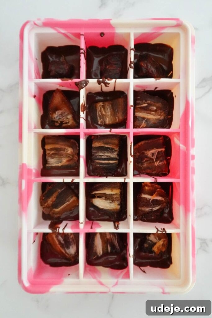 Guilt Free Four Ingredient Snickers Inspired Bites 3 Step-by-step image of making healthy Snickers bites, showing pitted dates and peanut butter.