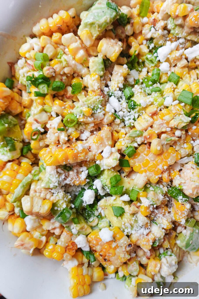 Vegan Esquites Salad 2 A bowl of vibrant vegan Mexican street corn salad with fresh corn, avocado, and herbs.