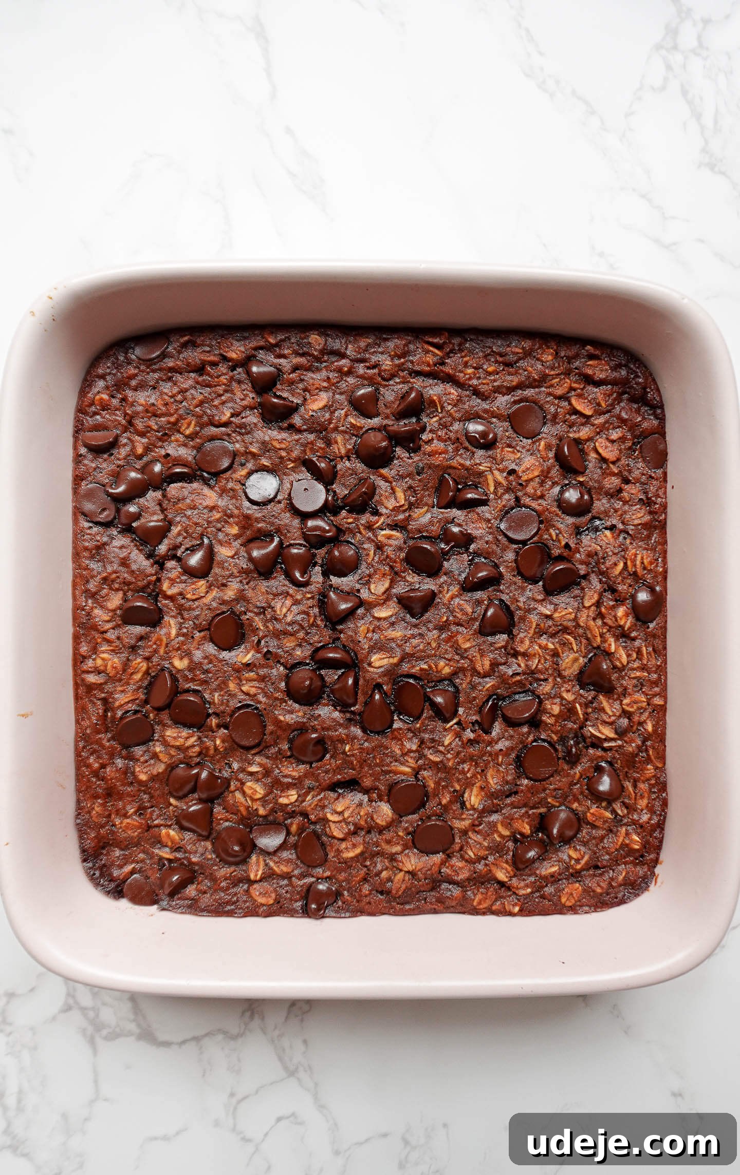 Decadent Chocolate Baked Oats 3 Preparing the wet ingredients for wholesome Brownie Baked Oatmeal, emphasizing vegan and gluten-free qualities for a healthy breakfast.