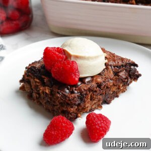 Close-up of a square piece of Brownie Baked Oatmeal with melted chocolate chips