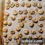 lightly browned shish barak on a parchment lined baking sheet