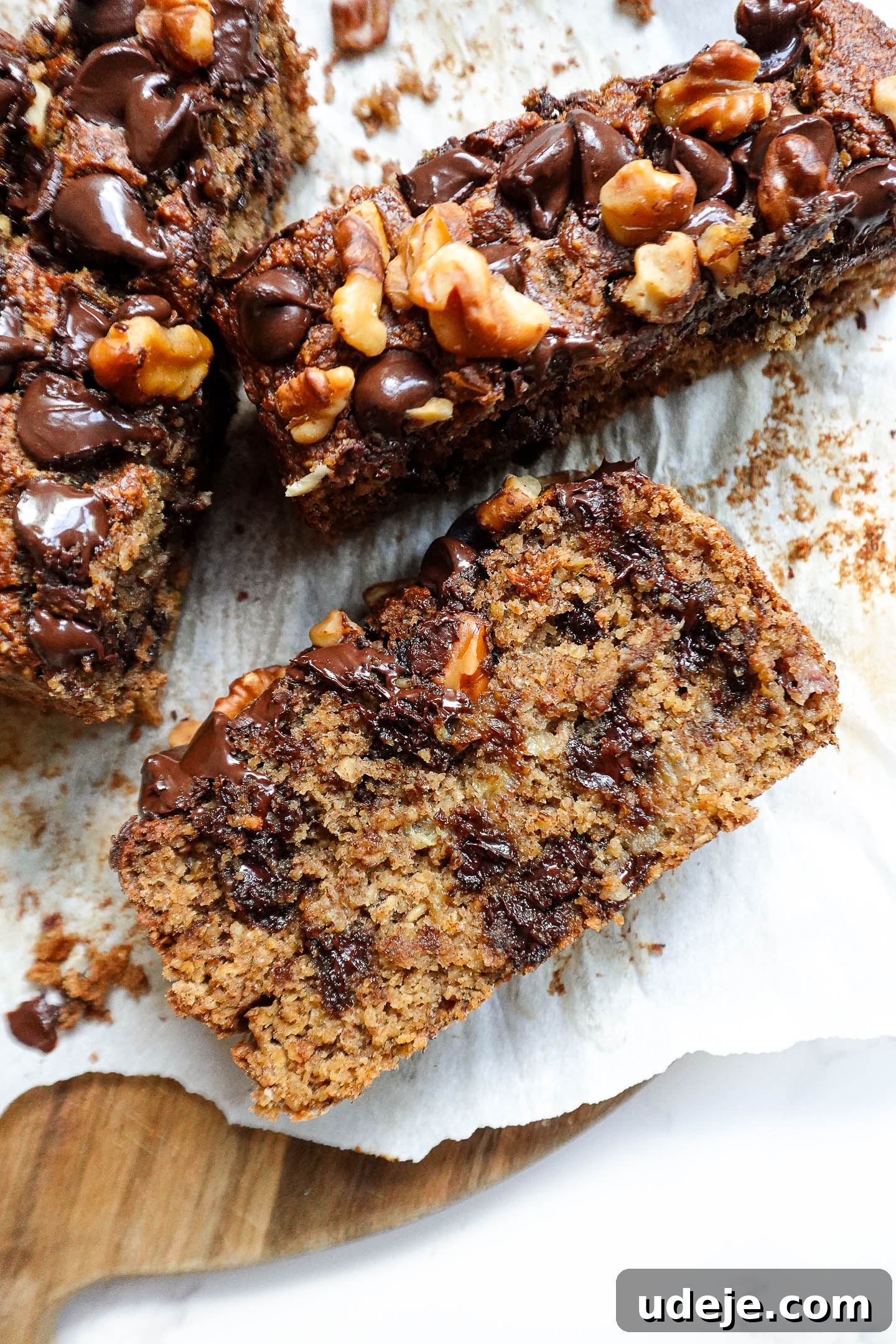 Ultimate Healthy Vegan and Gluten Free Banana Bread 6 A top-down view of a whole loaf of vegan and gluten-free banana bread with walnuts and chocolate chips.