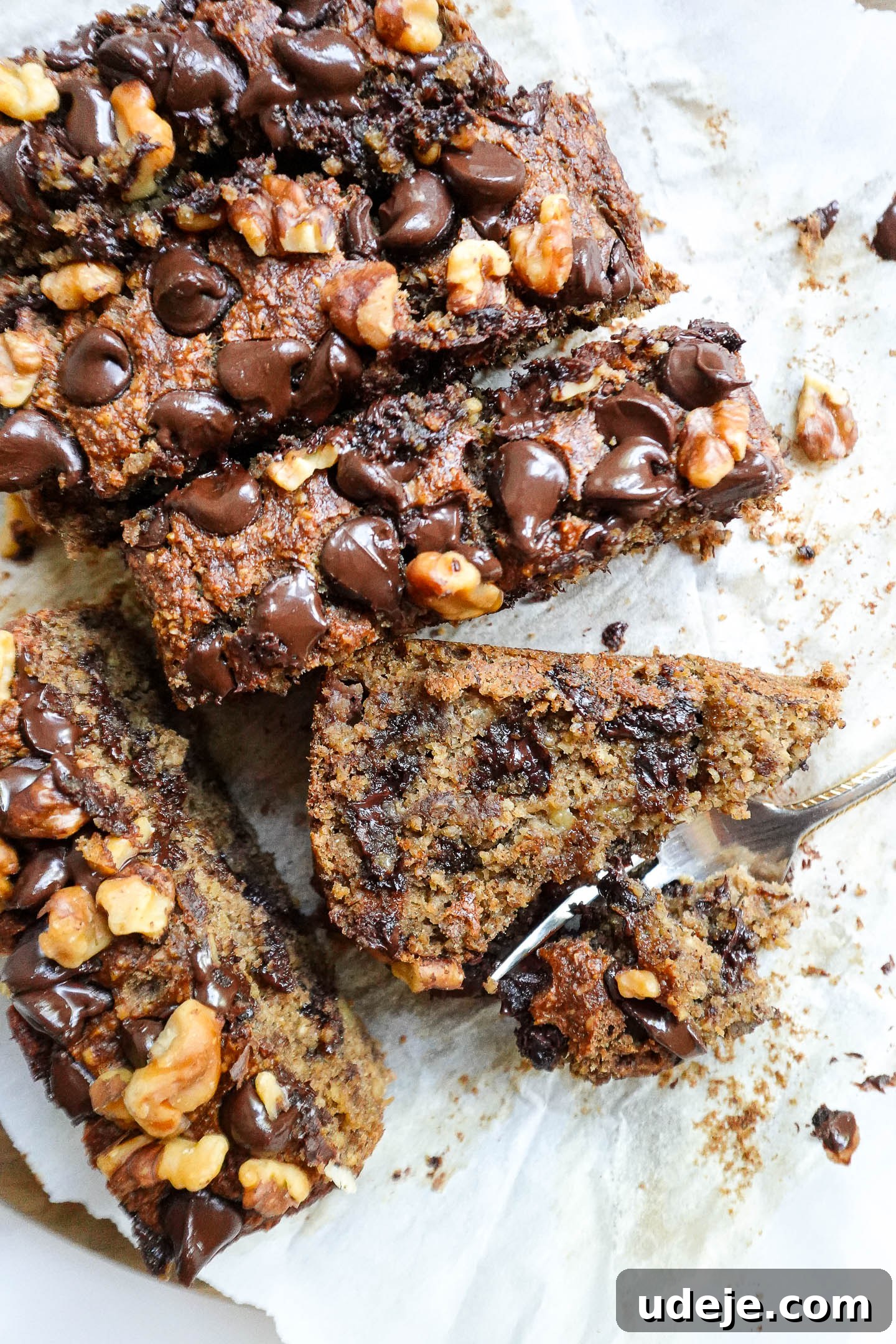 Ultimate Healthy Vegan and Gluten Free Banana Bread 10 Three slices of vegan and gluten-free banana bread stacked on a plate.