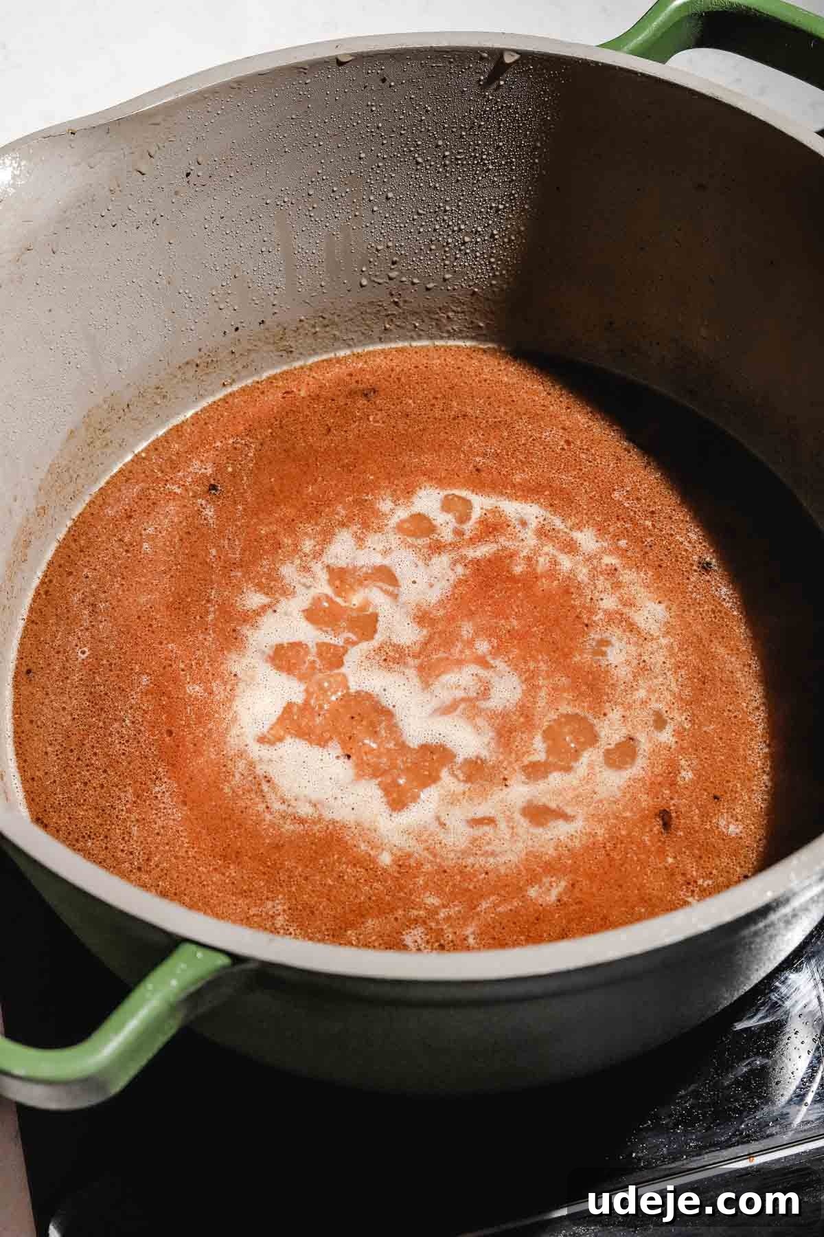 Lebanese Moghrabieh Pearl Couscous Delight 14 chicken broth and spices in a large pot