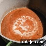 chicken broth and spices in a large pot