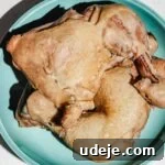 boiled skin on and bone in chicken legs in a blue plate
