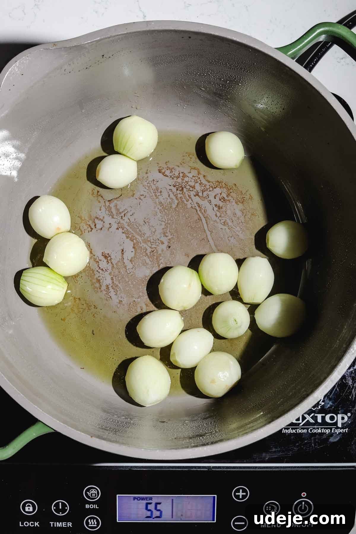 Lebanese Moghrabieh Pearl Couscous Delight 10 pearl onions with olive oil, in a large pot on an induction element