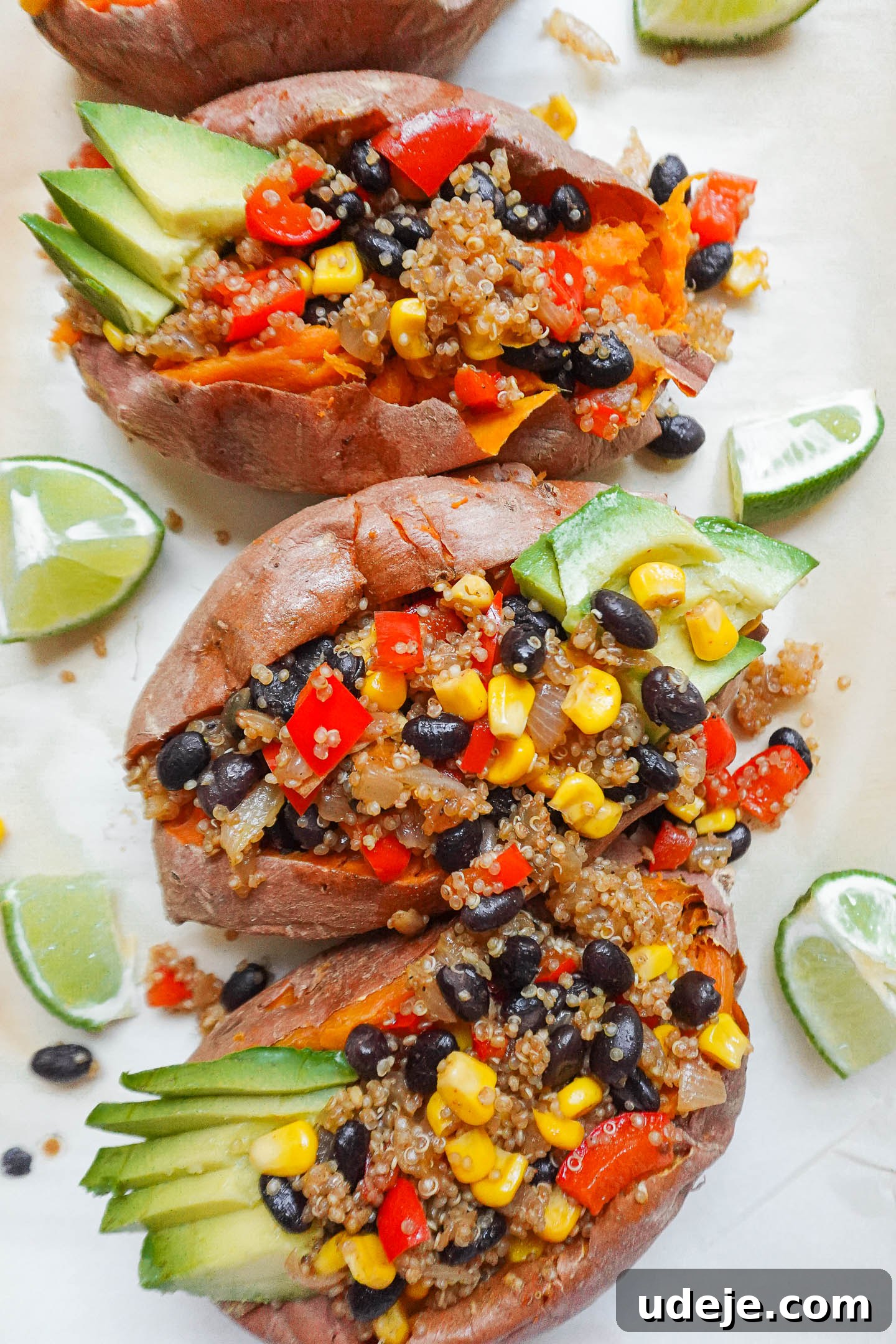 Quinoa Stuffed Sweet Potatoes topped with avocado and lime – a perfect healthy meal.