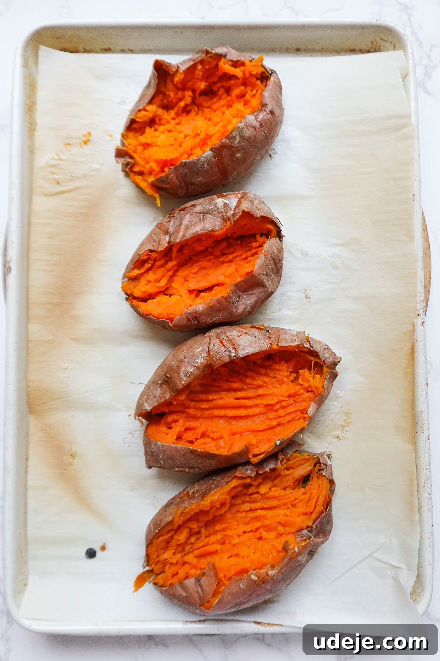 Baked sweet potatoes showing their soft, cooked interior.