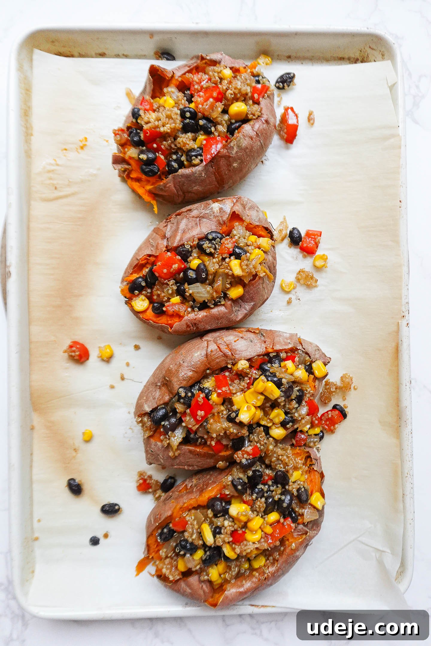Baked sweet potatoes filled with quinoa and black bean mixture.