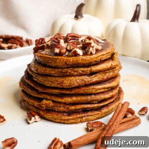 A small image of vegan pumpkin pancakes with cinnamon butter.