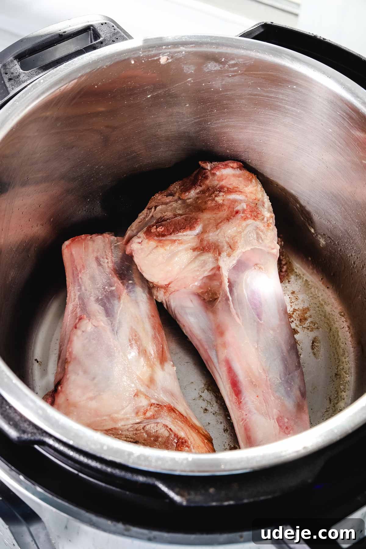 Syrian Shakriyeh: Velvety Lamb and Yogurt Stew 6 lamb shanks being seared in an instant pot