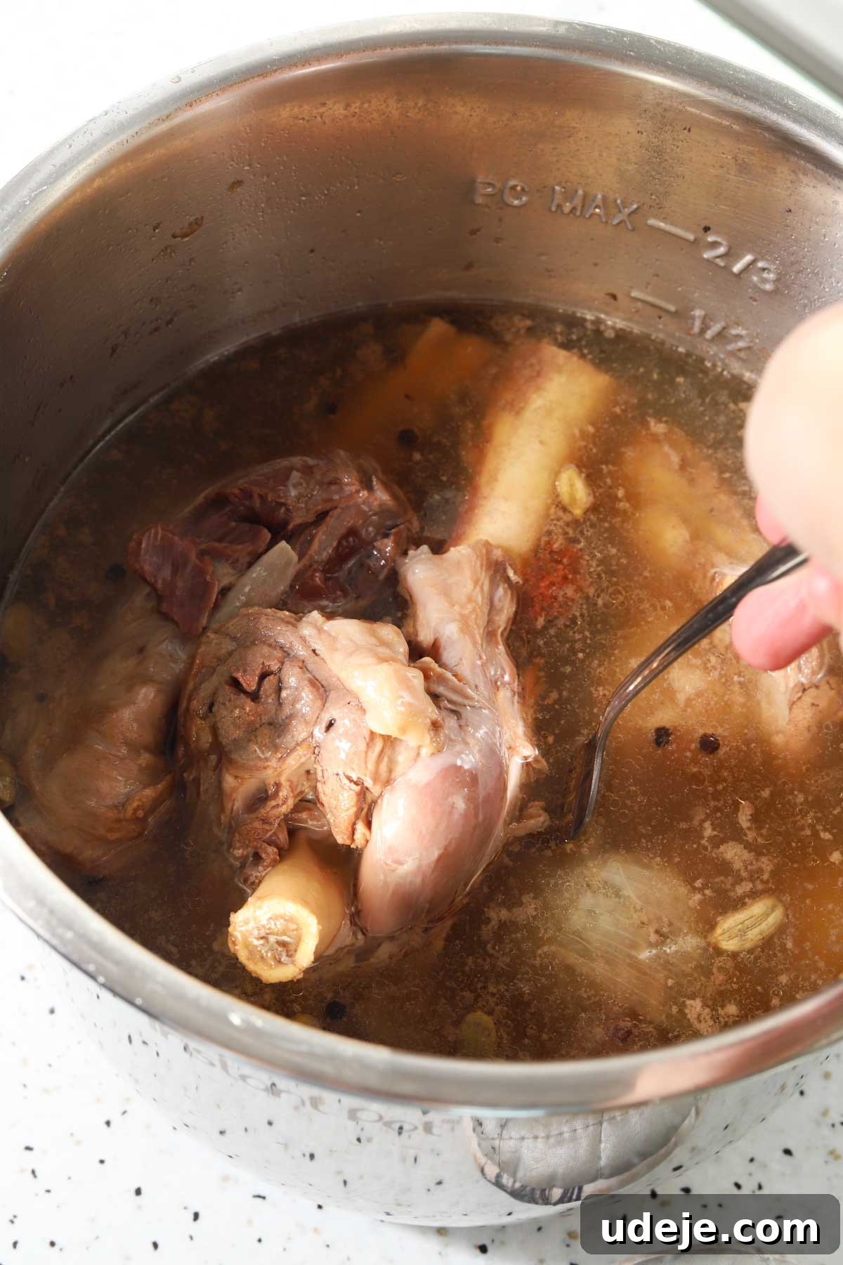 Syrian Shakriyeh: Velvety Lamb and Yogurt Stew 9 lamb shanks that have been pressure cooked along with broth and whole spices inside an instant pot