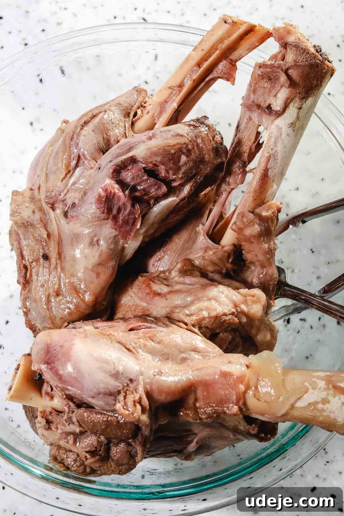 Syrian Shakriyeh: Velvety Lamb and Yogurt Stew 10 lamb shanks that have been pressure cooked placed inside a glass bowl