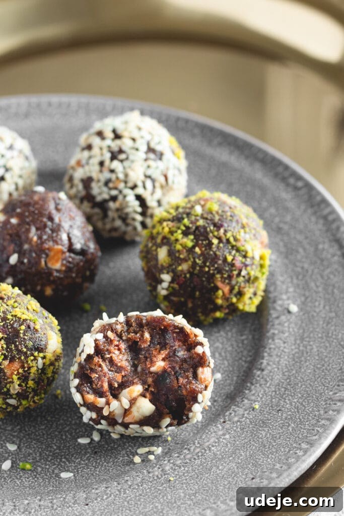 Wholesome Cardamom and Tahini Date Bliss Balls 3 Date Truffles on a platter on top of a gold tray
