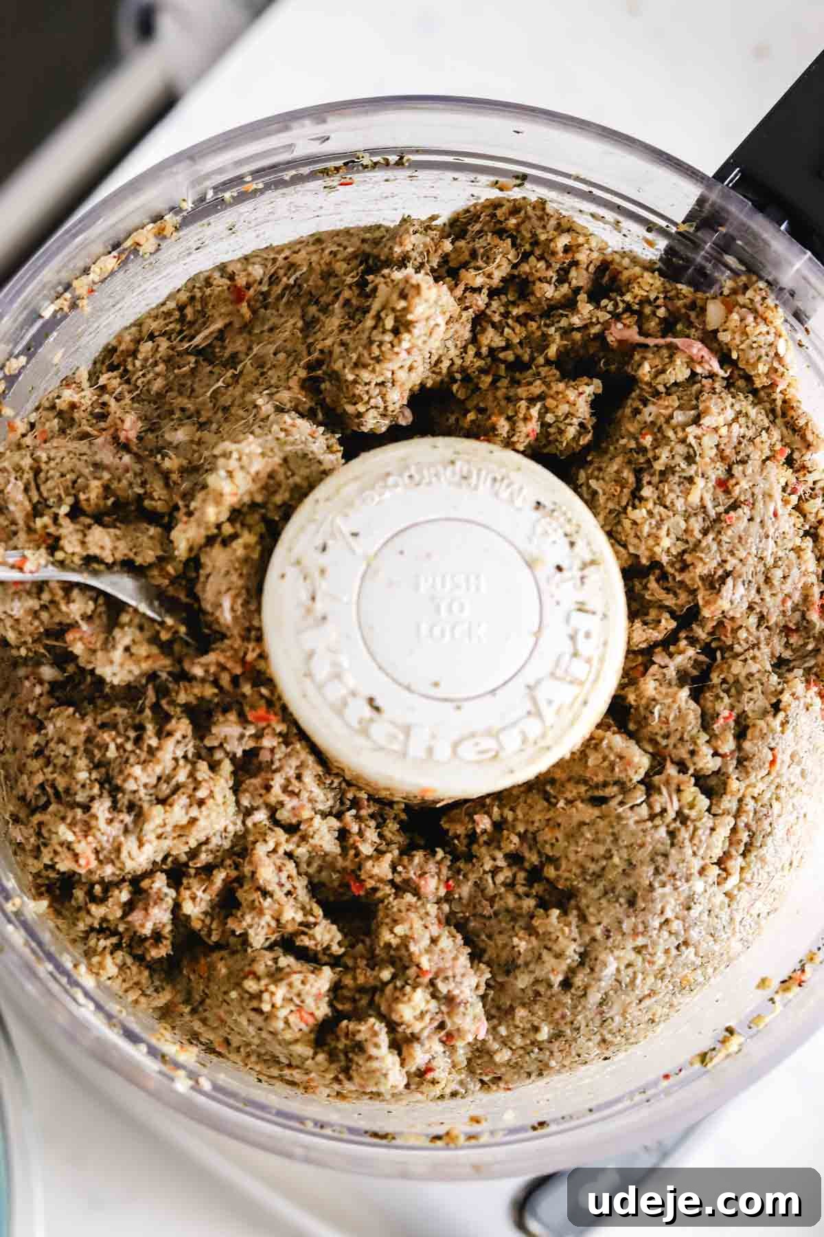 Baked Kibbeh Casserole 12 Smooth, processed kibbeh dough in a food processor, illustrating the final texture and consistency before assembly.