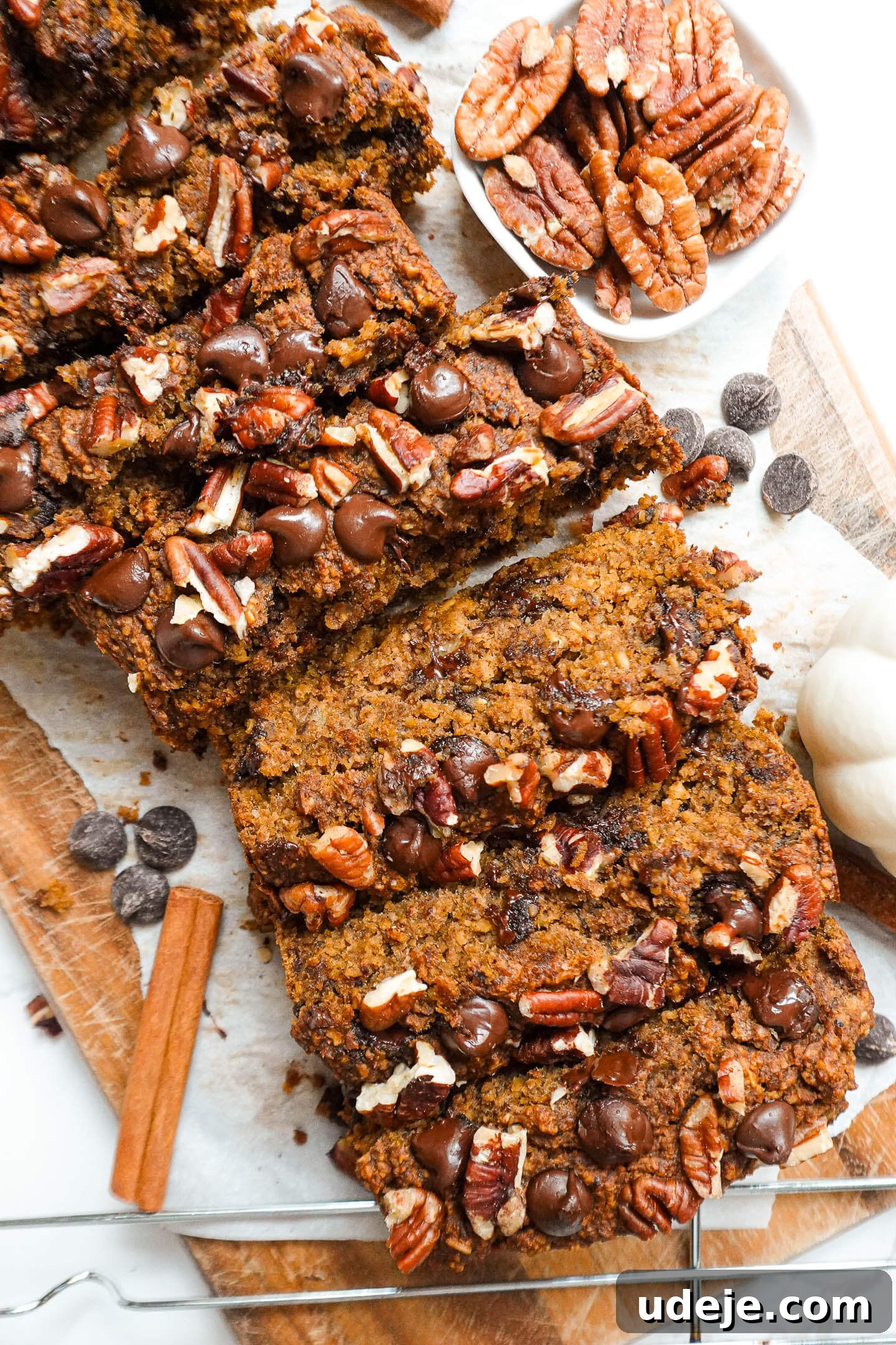 Warm Spiced Vegan Gluten Free Pumpkin Banana Bread 5 Slices of moist pumpkin spice banana bread with a soft, fluffy texture, showing rich pockets of chocolate chips and pecans