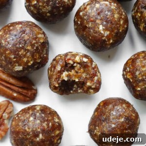 Pecan Pie Power Bites 8 No-bake energy balls with pecans, oats, and dates, perfect for a quick, nutritious snack.