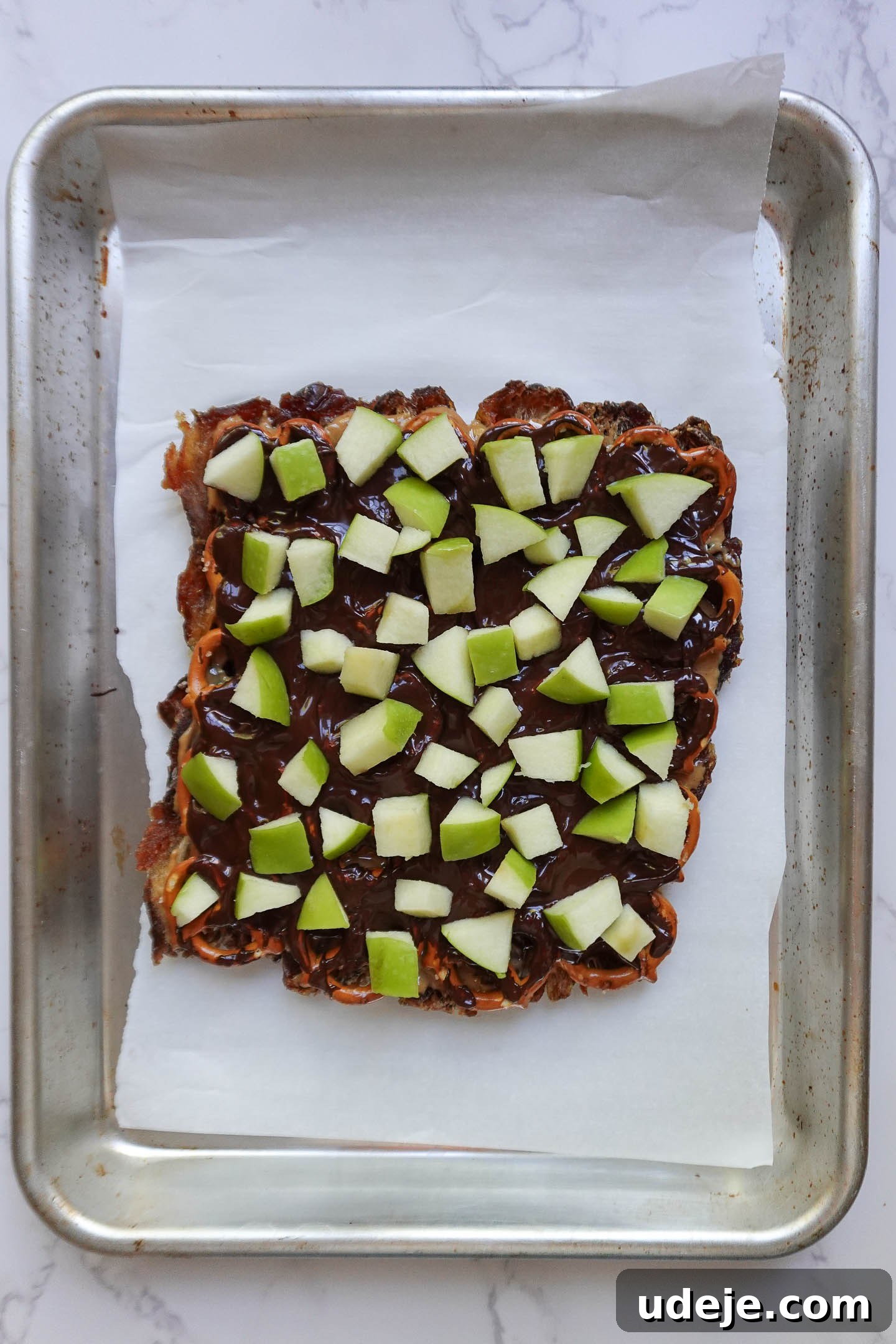 Wholesome Apple Date Caramel Bark 6 diced green apples sprinkled over chocolate-covered date bark