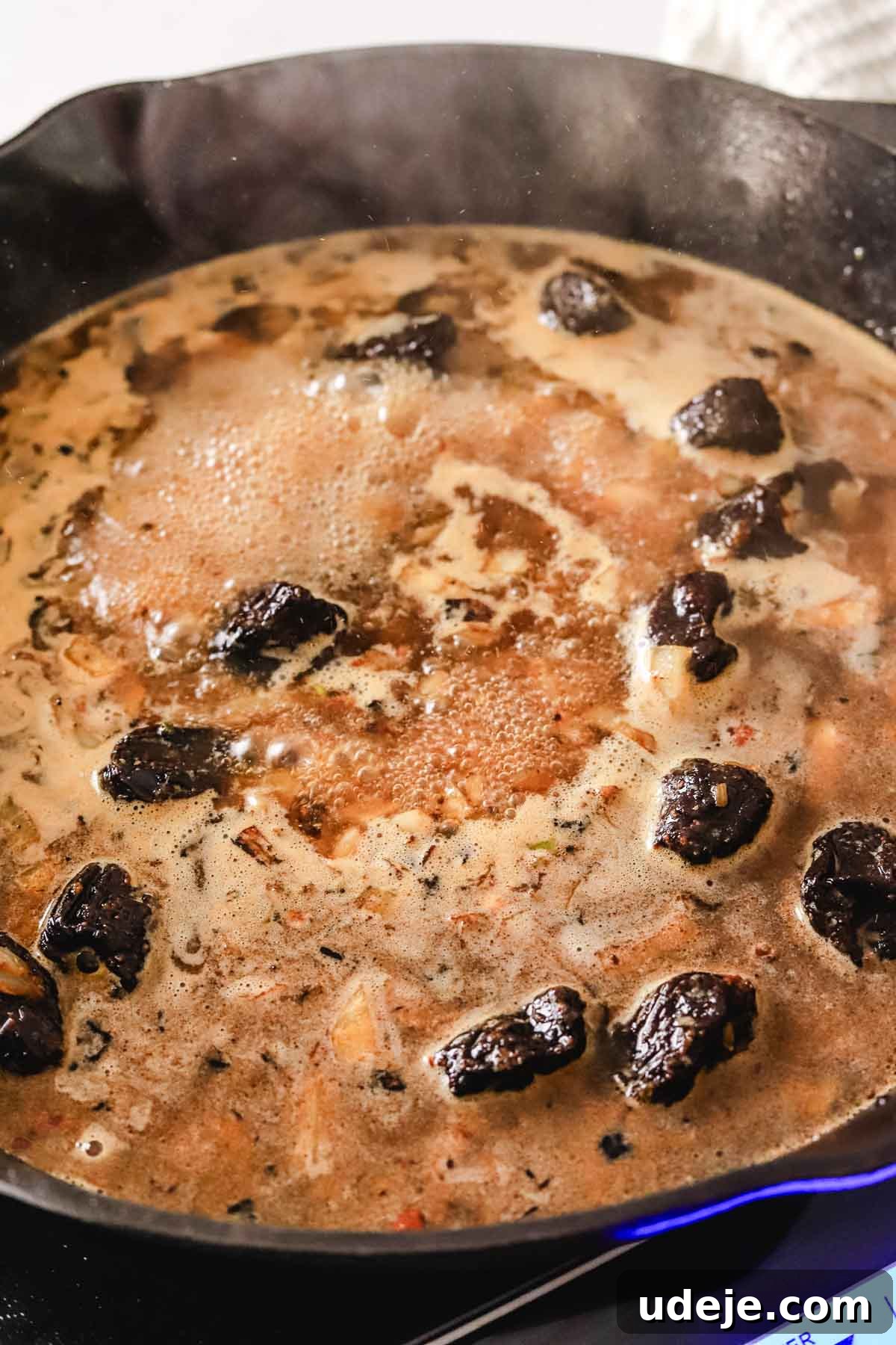 Golden Crispy Moroccan Oven Chicken 12 Sautéed onions with prunes in chicken broth in a large cat iron pan