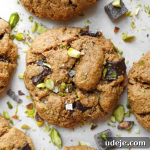 Close-up of soft, chewy pistachio chocolate chip cookies made with oat flour