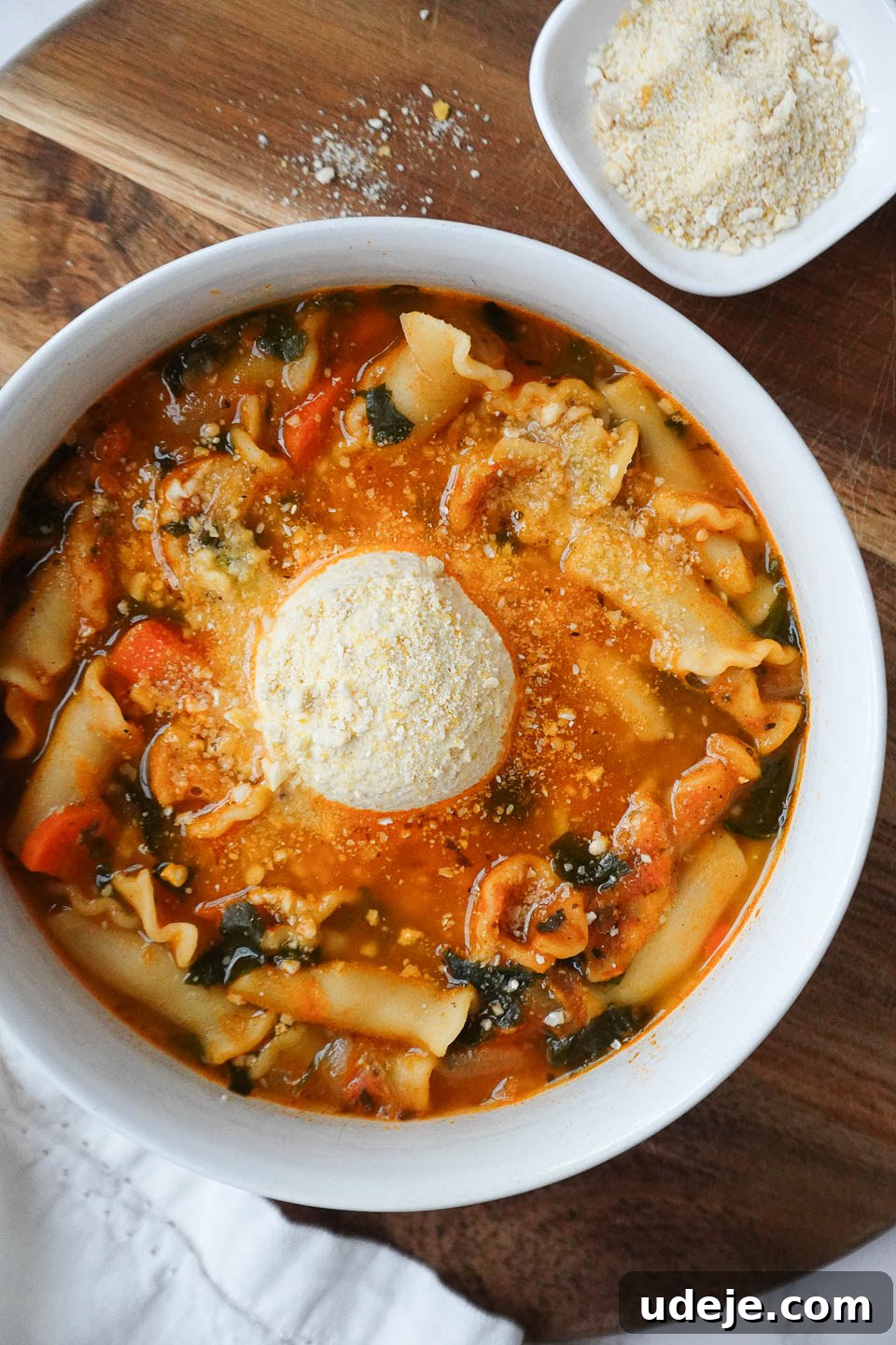 Simple One Pot Vegan Lasagna Soup 2 A vibrant bowl of vegan lasagna soup, featuring robust vegetables, tender red lentils, classic lasagna noodles, creamy tofu ricotta, and a sprinkle of cashew parmesan for extra flavor.