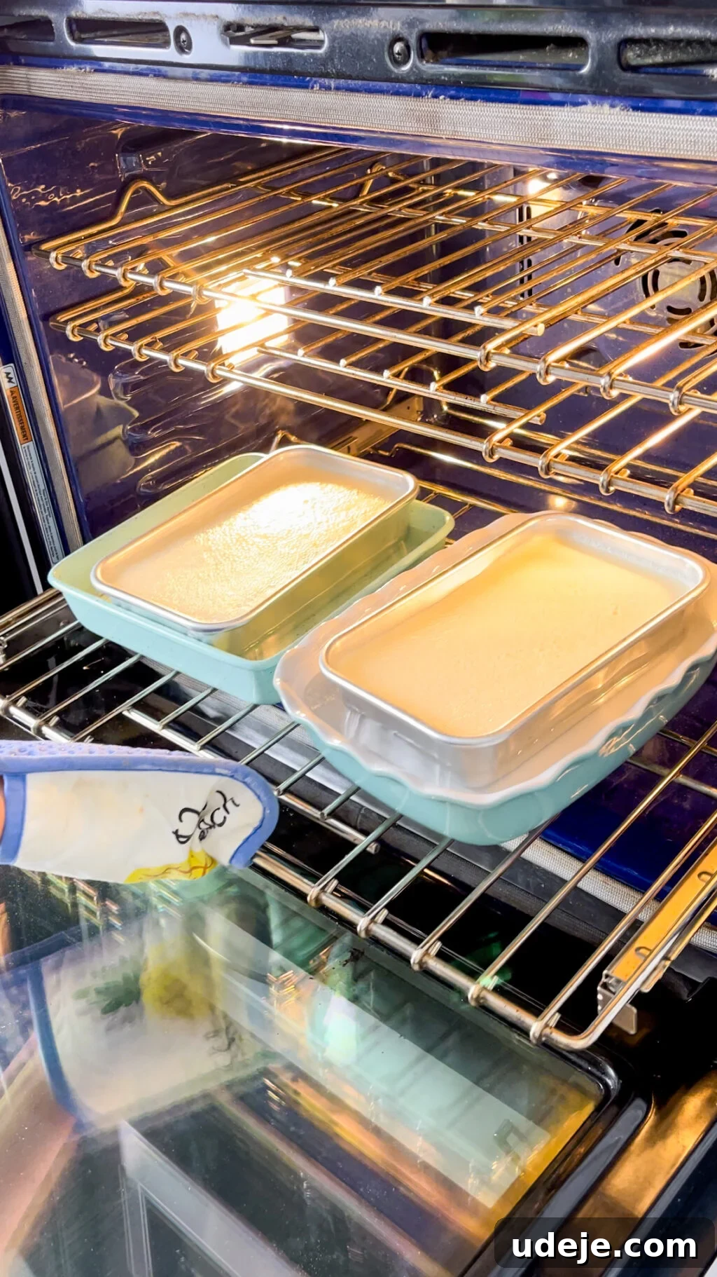 Creamy Condensed Milk Creme Caramel 16 2 creme caramel's in mint coloured baking dishes being placed in an open oven