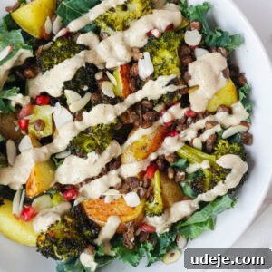 Nourishing Roasted Potato and Lentil Harvest Bowl 5 Roasted Potato & Lentil Buddha Bowl with crispy lentils, roasted broccoli, golden potatoes, sautéed kale, and topped with sliced almonds, pomegranate seeds, and a drizzle of creamy lemon tahini dressing.