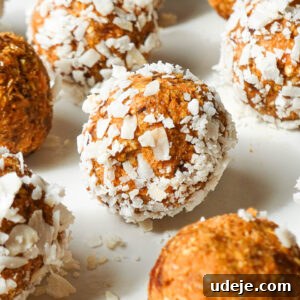 No bake carrot cake energy balls rolled in shredded coconut