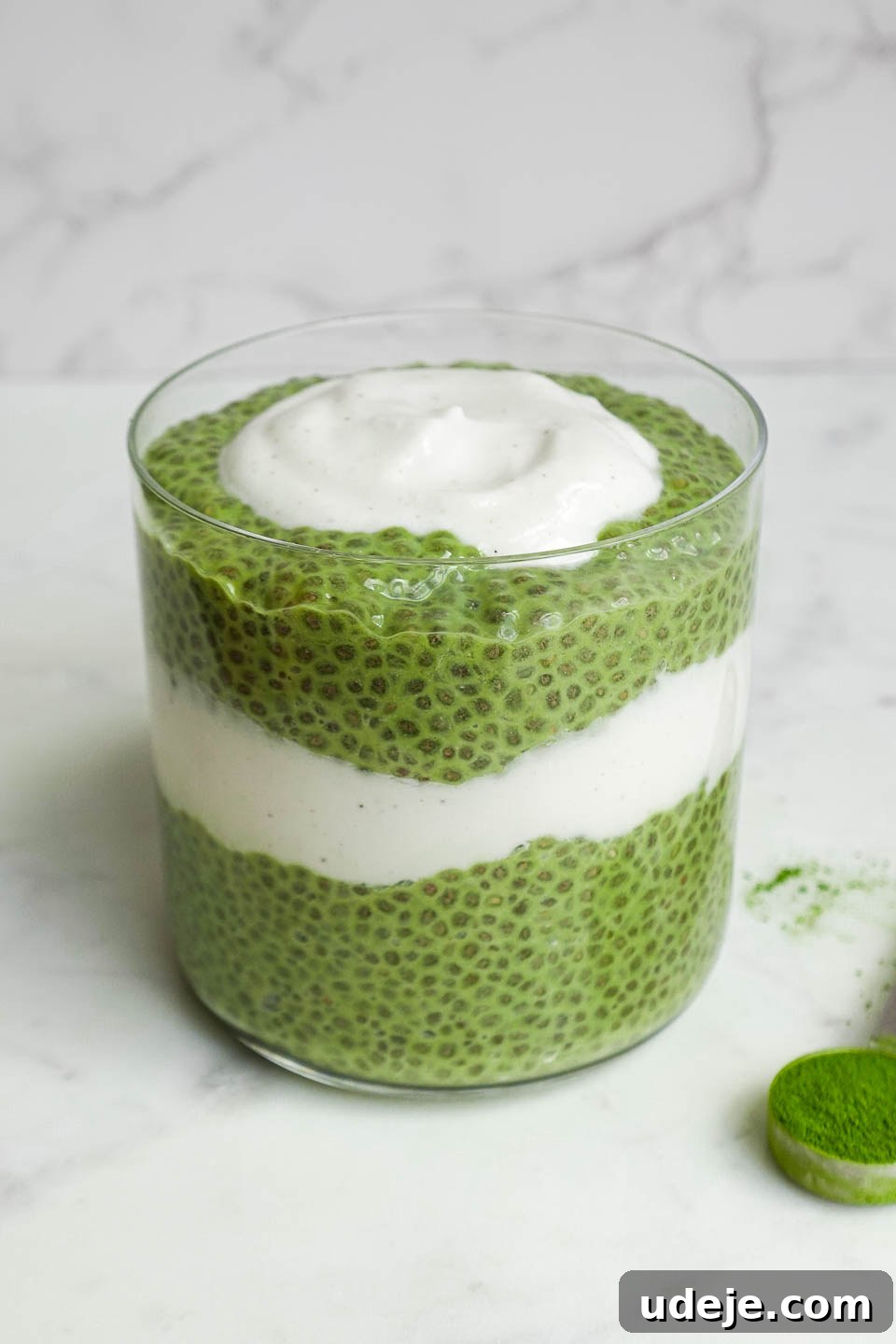 Energizing Matcha Chia Delight 3 Close-up of creamy green matcha chia pudding in a glass jar, perfectly layered for a healthy vegan breakfast or snack.