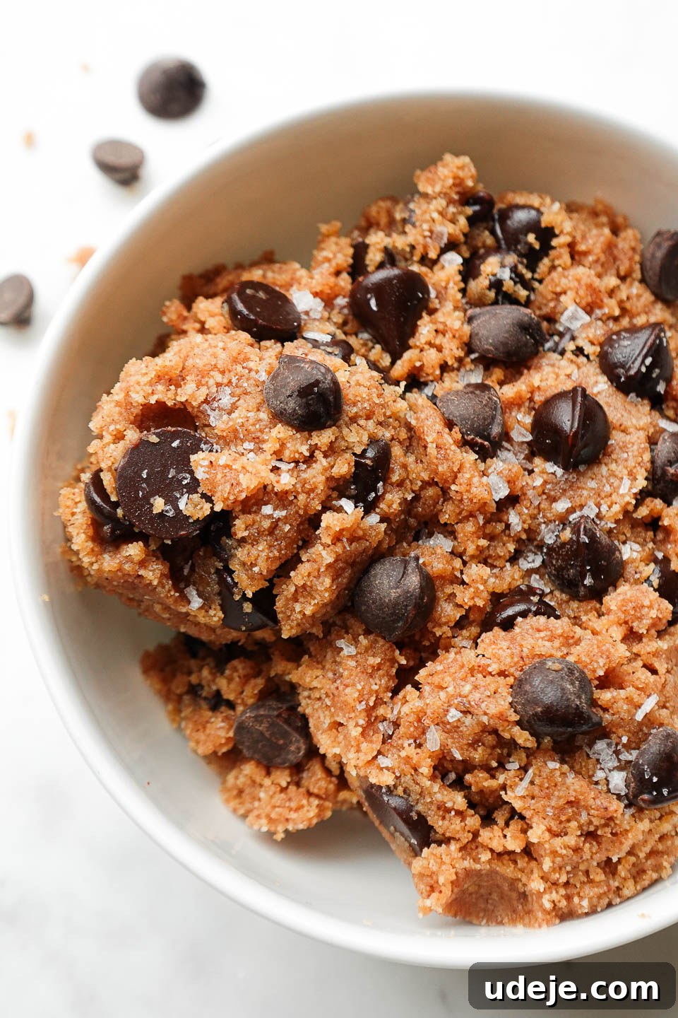 Guilt-Free Vegan Gluten Free Cookie Dough 2 Close-up of vegan and gluten-free edible cookie dough topped with dark chocolate chips and flaky sea salt