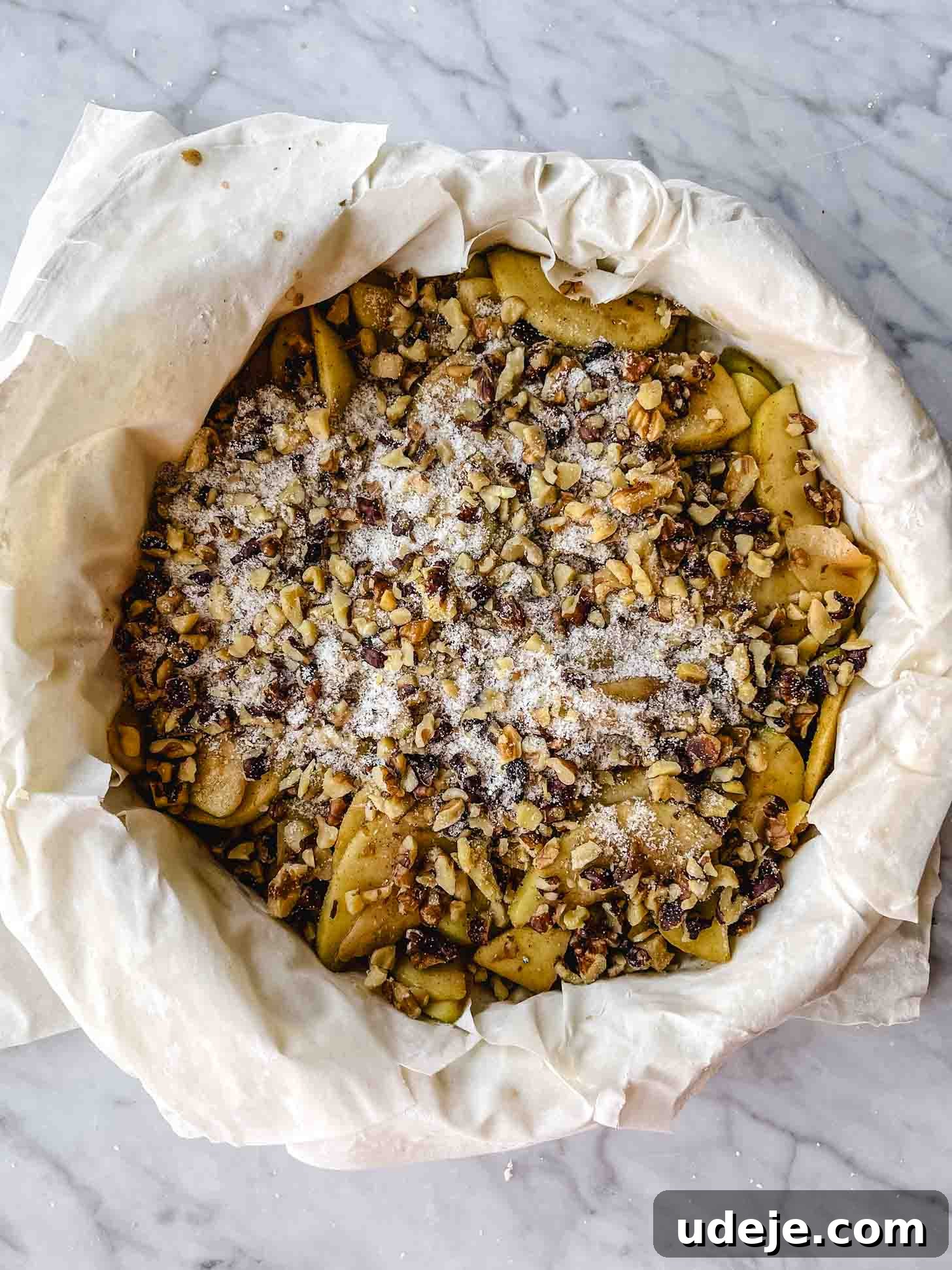 Apple Pie Meets Baklava 15 The remaining walnut mixture topping the apple filling in the phyllo-lined springform pan.