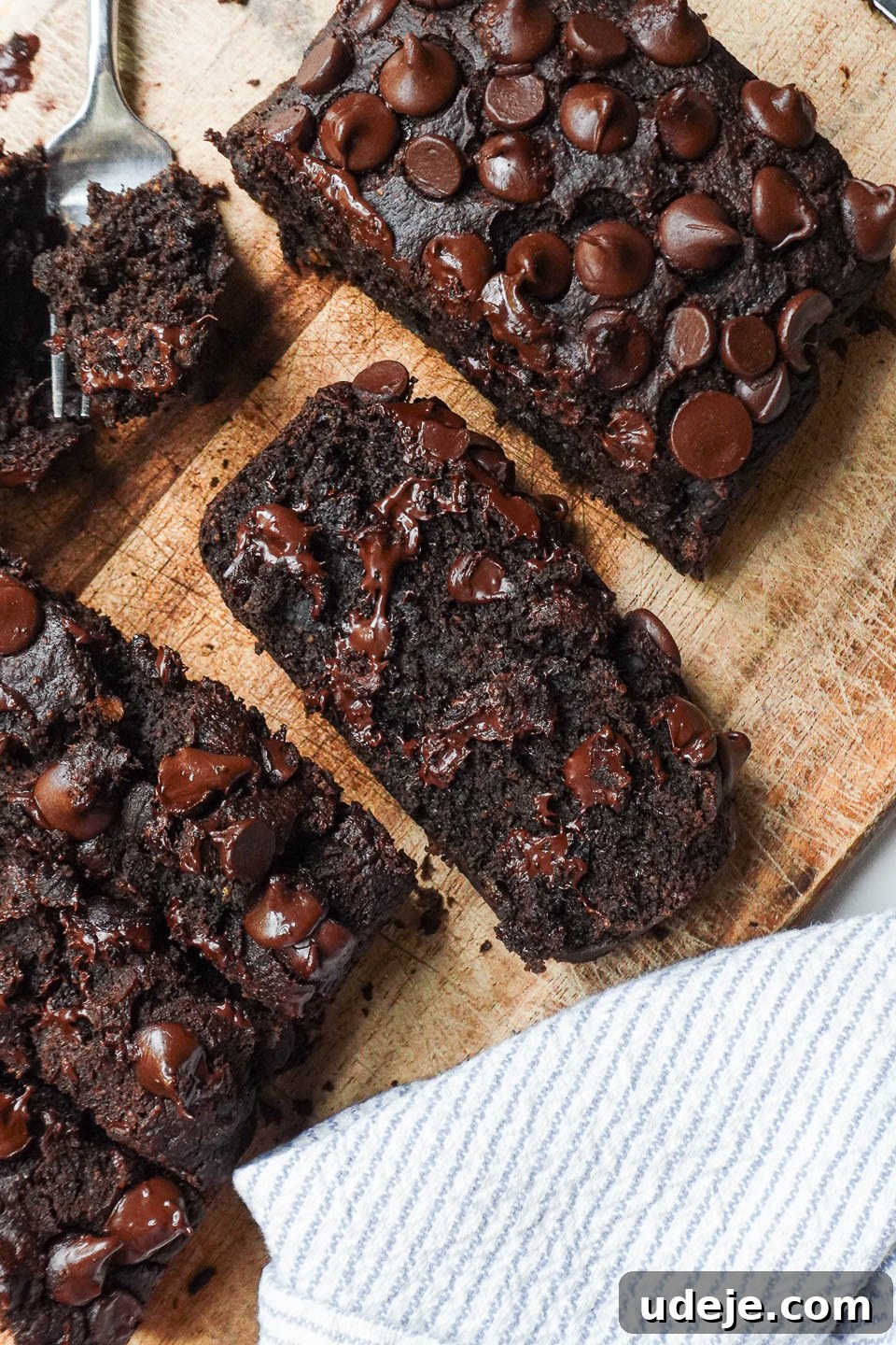 Wholesome Vegan Gluten-Free Chocolate Banana Bread 6 Overhead shot of a thick slice of moist and fluffy vegan chocolate banana bread, showing luscious gooey chocolate chips throughout.