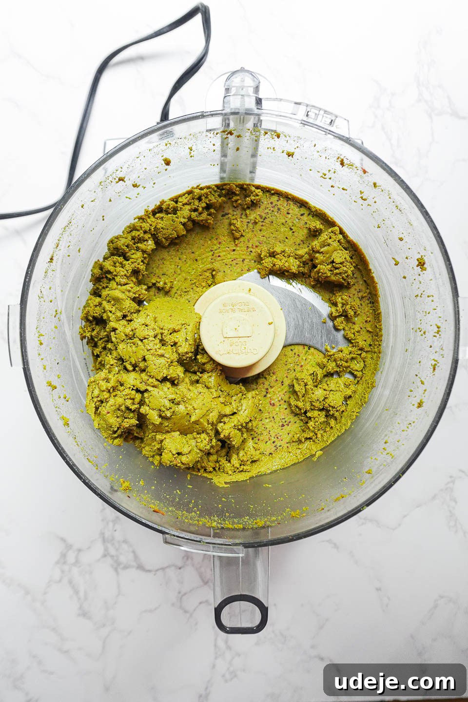 Artisan Pistachio Spread 9 A visual progression of pistachios transforming into butter, from raw nuts to a smooth, creamy spread in a food processor.